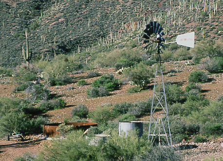 Windmill and water storage tank, Tonto National Forest, east of Dutchwoman Butte, Arizona. Photo by Mike Hudak.