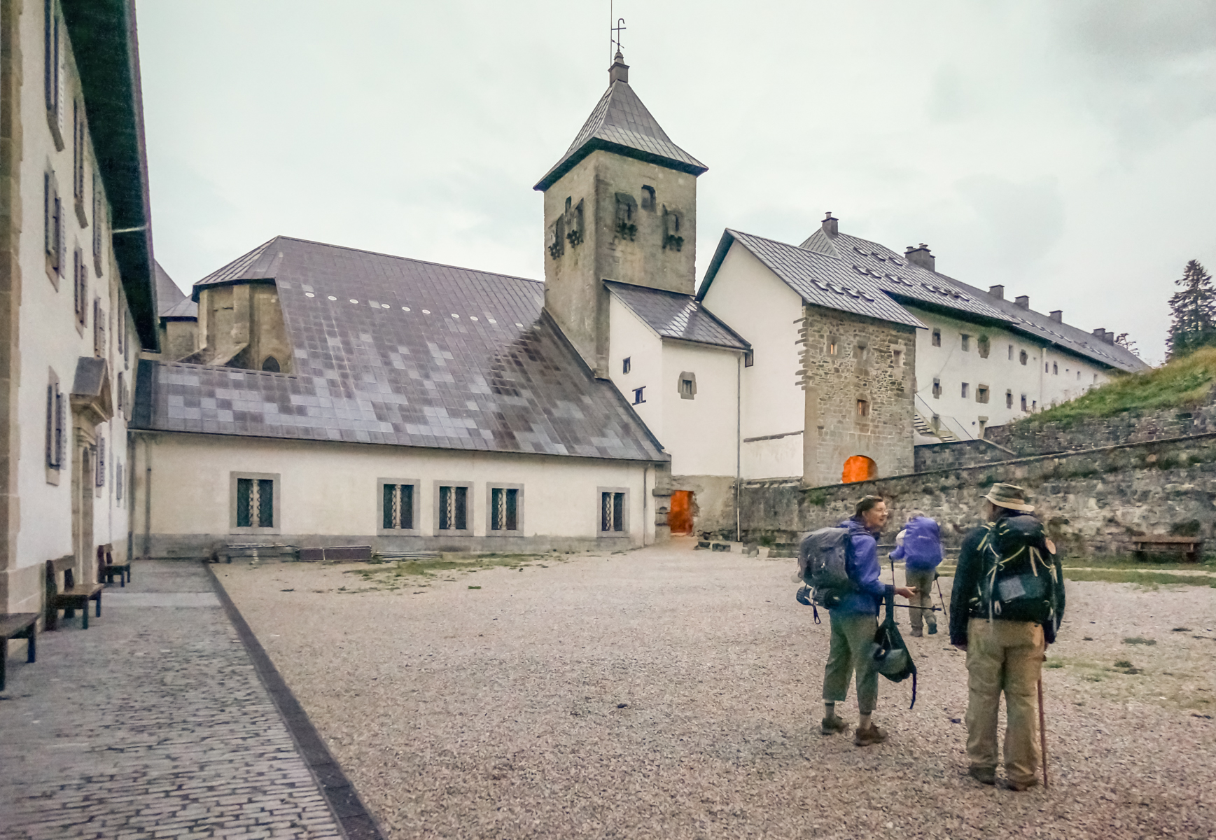 Morning departure of Camino pilgrims from Albergue Roncesvalles | Photo by Mike Hudak