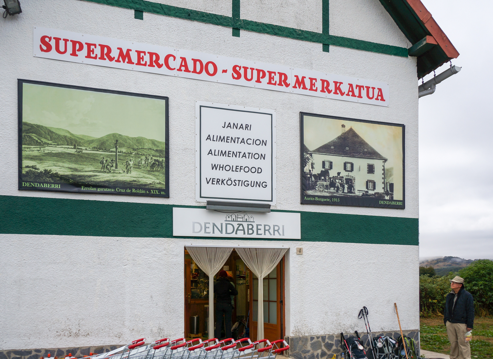 Camino pilgrims shop at grocery store in Burguete, Spain | Photo by Mike Hudak