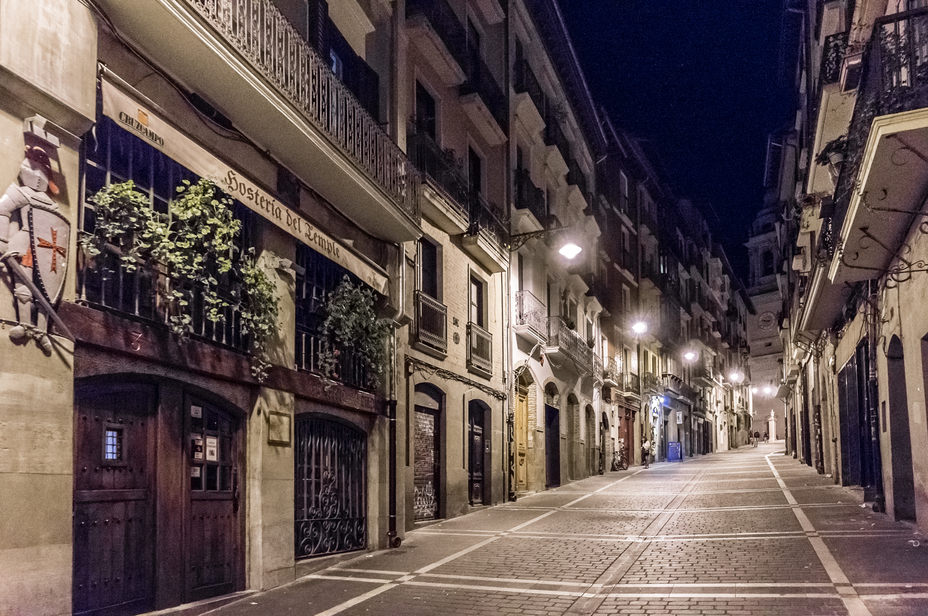Nearly deserted street at night, Pamplona, Spain | Photo by Mike Hudak.