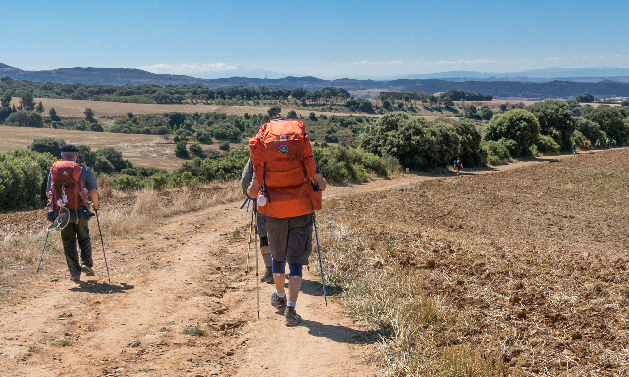 Camino Francés pilgrims approximately 2.3 km west of Alto del Perdón | Photo by Mike Hudak