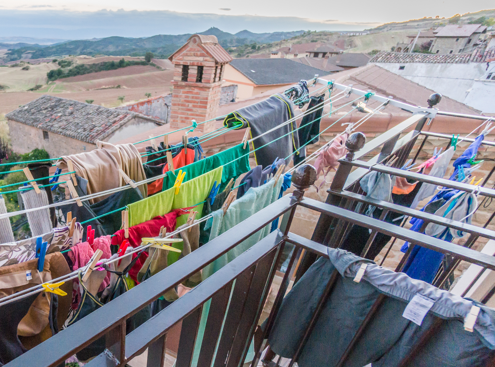 Pilgrim laundry hangs from balcony clotheslines at Albergue Villamayor de Monjardin, Spain | Photo by Mike Hudak