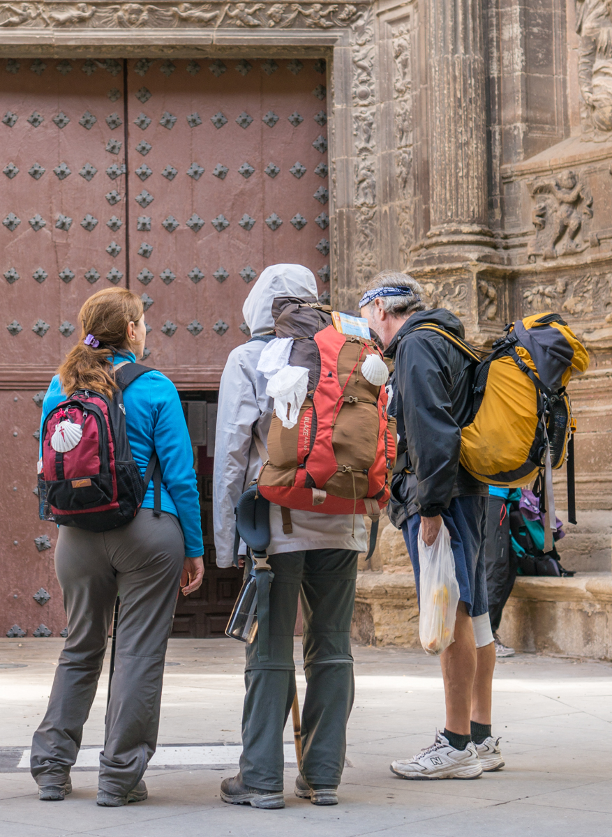 Camino pilgrims view the tomb of Cesare Borgia outside the Iglesia de Santa Maria, Viana, Spain | Photo by Mike Hudak