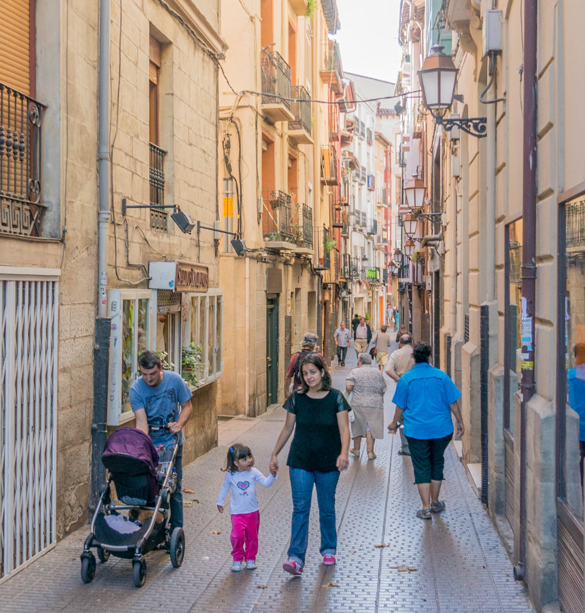 Camino pilgrim Maria (on right in blue shirt) walks through Logroño, Spain, in search of 2nd night, non-pilgrim lodging | Photo by Mike Hudak