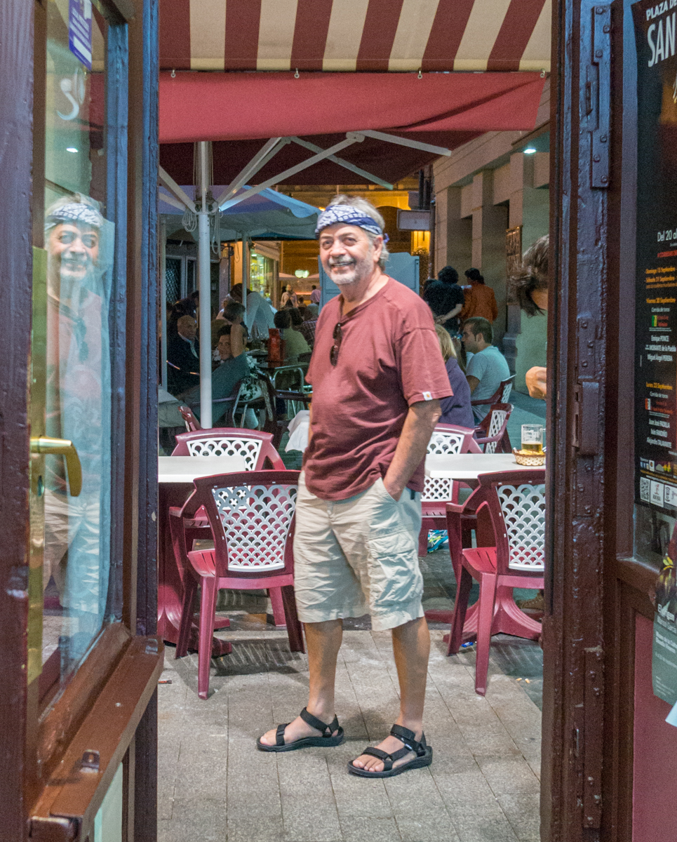 Camino pilgrim stands in doorway of Café Moderno, Logroño, Spain | Photo by Mike Hudak