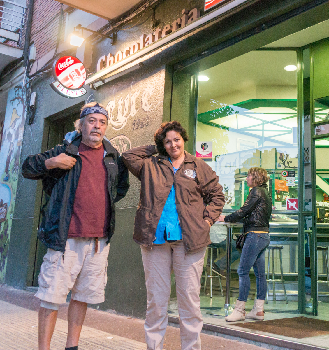 Camino pilgrims stand in front of a chocolateria in Logroño, Spain | Photo by Mike Hudak