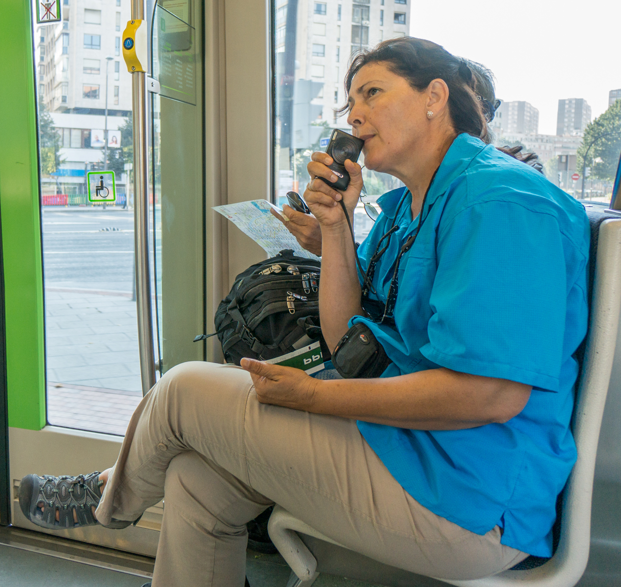 A Camino pilgrim rides a tram from the Bilbao bus station to the Guggenheim Museum Bilbao (Spain) | Photo by Mike Hudak