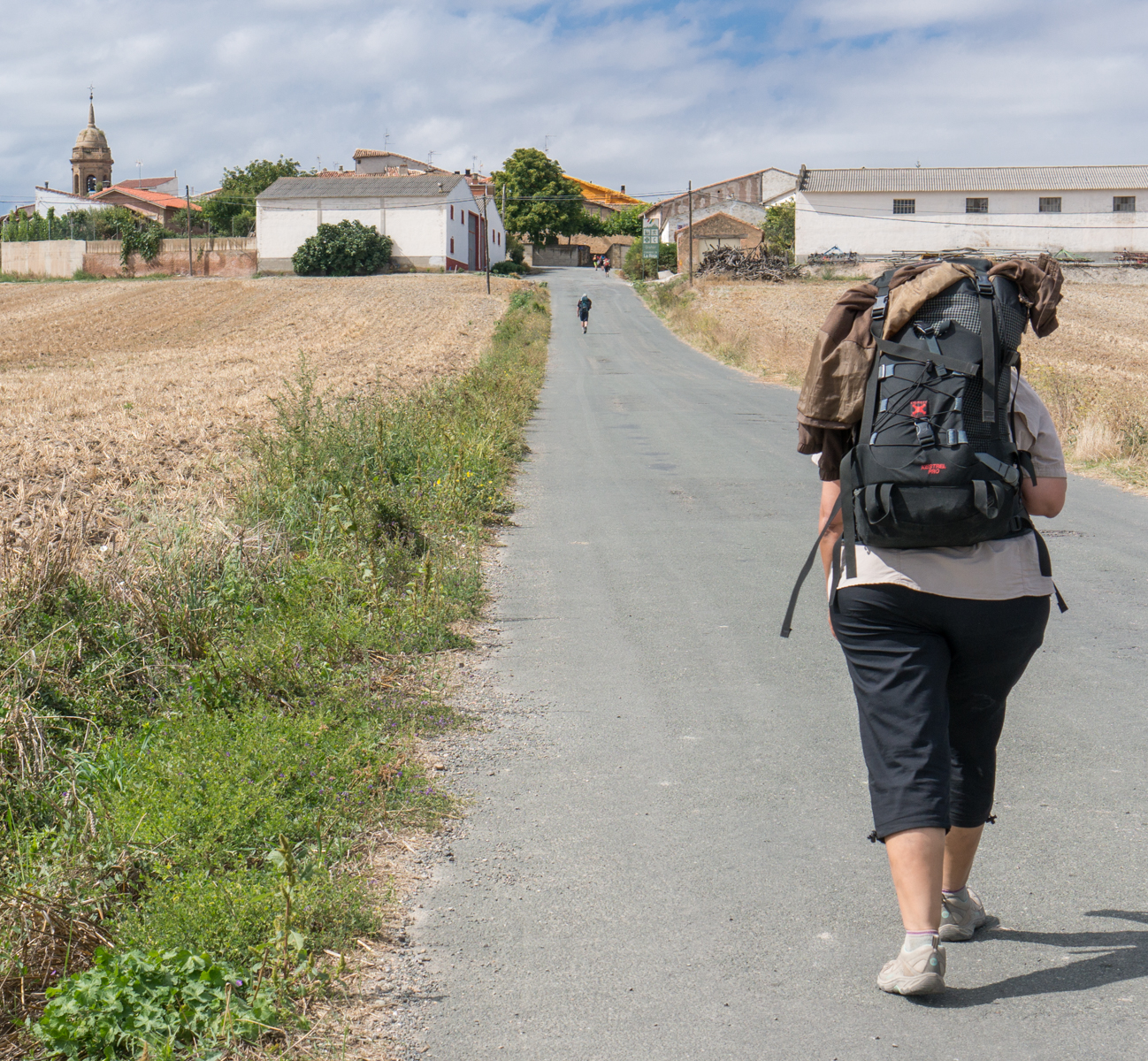 A Camino pilgrim approaches Grañon | Photo by Mike Hudak