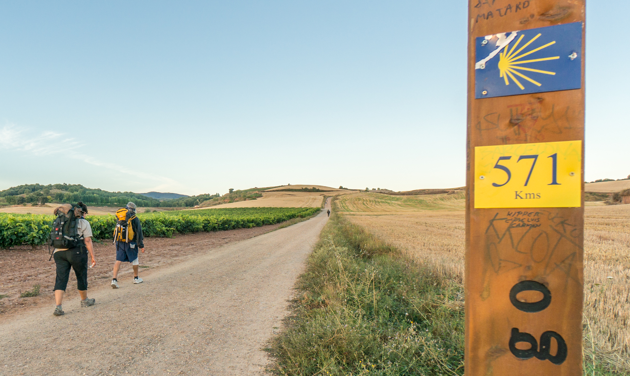 Pilgrims on the Camino Francés 571 km from Santiago de Compostela, Spain | Photo by Mike Hudak