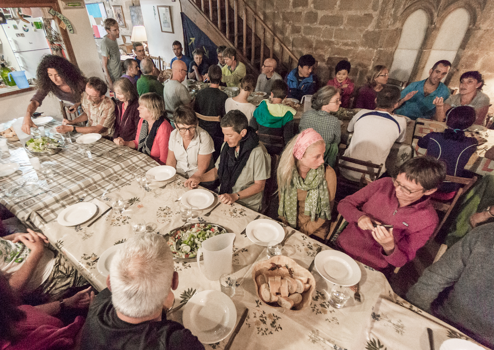 Communal meal for Camino pilgrims at Albergue San Juan Bautista, Granon, Spain | Photo by Mike Hudak