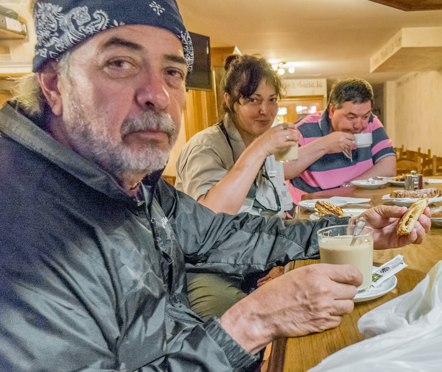 Camino pilgrims enjoy early morning coffee and pastry at a cafe in Redecilla del Camino, Spain | Photo by Mike Hudak