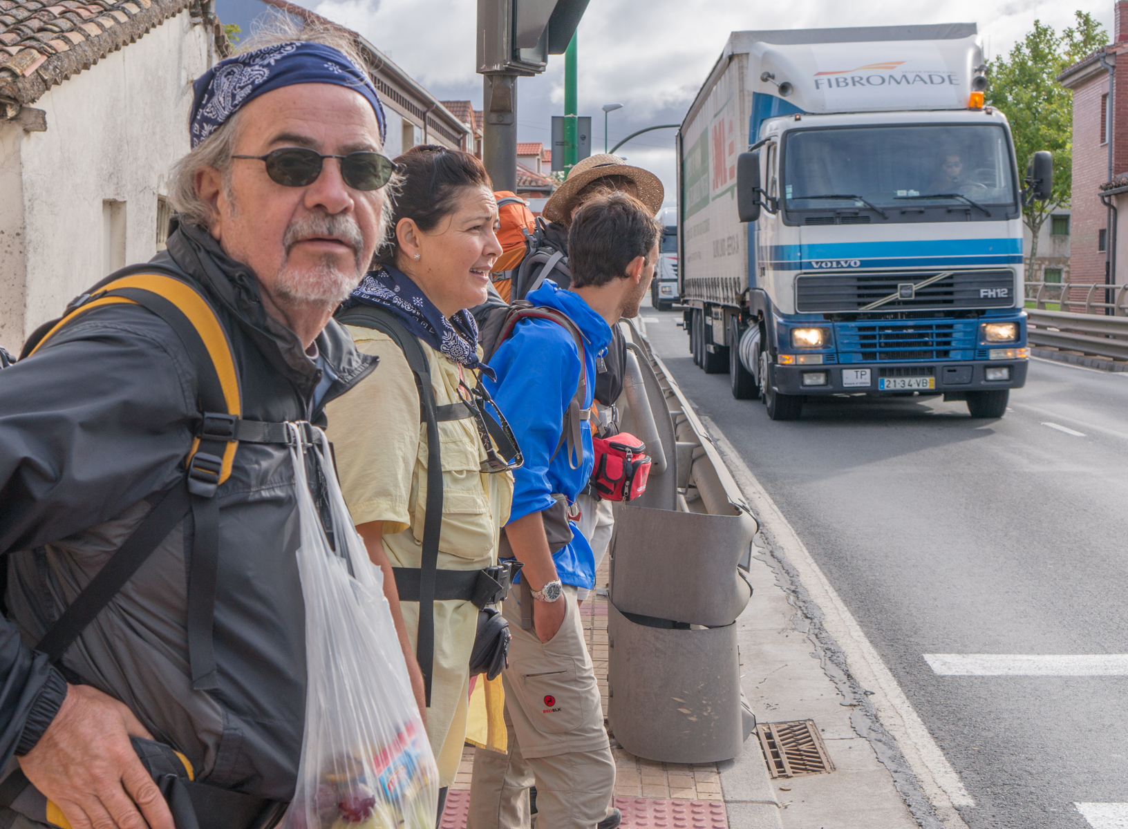 Camino pilgrims walk through the crowded streets of Castañares, a suburb of Burgos, Spain | Photo by Mike Hudak