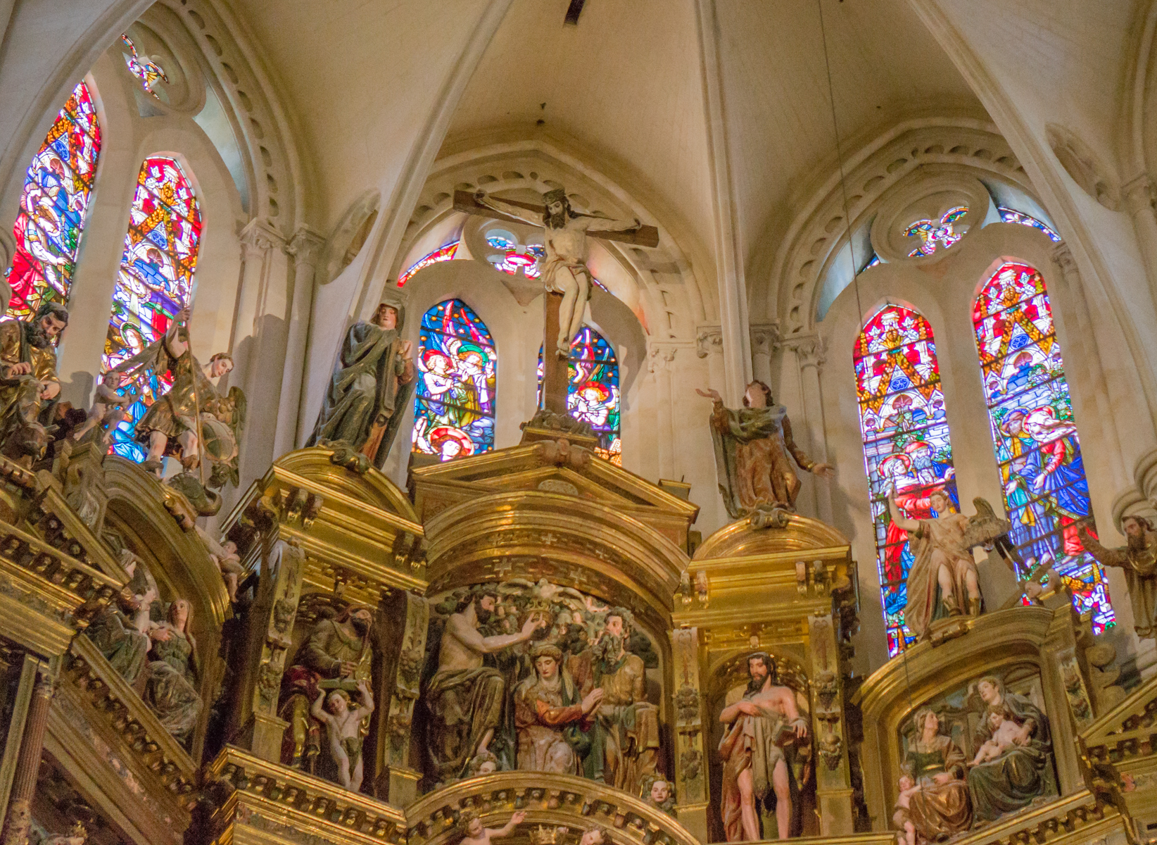 Main altar and surrounding stained glass windows at Catedral de Santa Maria de Burgos, Burgos, Spain | Photo by Mike Hudak