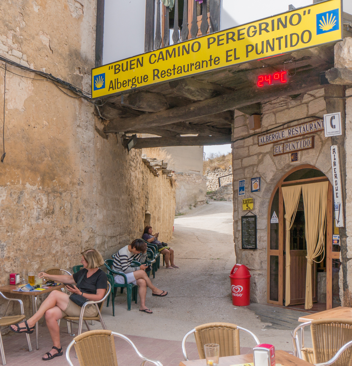 Camino pilgrims relax at Albergue El Puntido in Hortanas, Spain | Photo by Mike Hudak