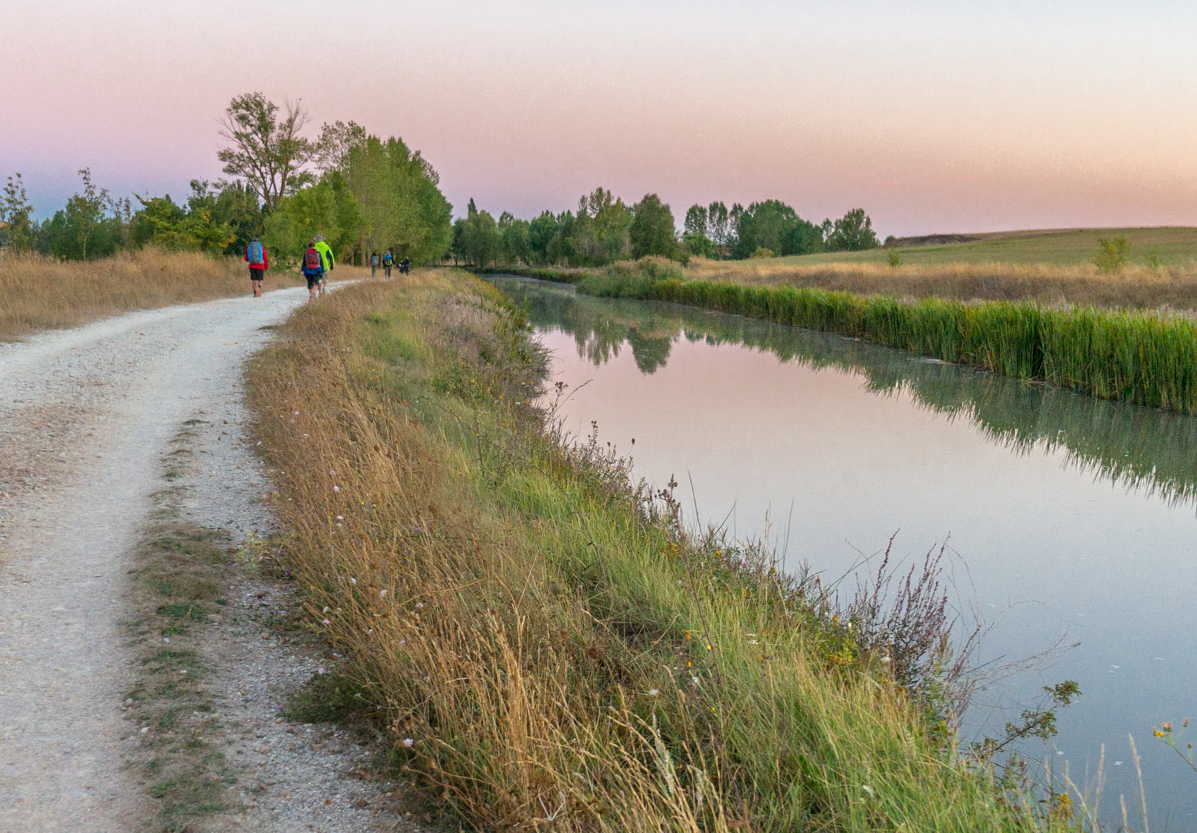 The Camino Francés along the Canal de Castilla as it approaches Frómista, Spain | Photo by Mike Hudak