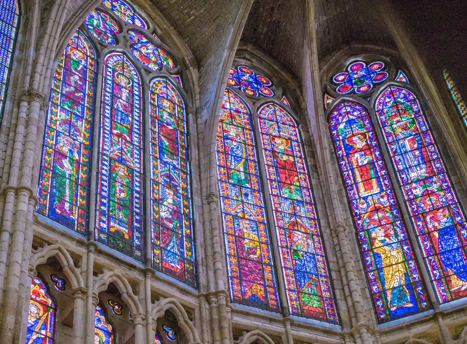 Stained glass windows above and to left of the main altar of the Catedral de Santa Maria de Regla de Leon (Spain) | Photo by Mike Hudak