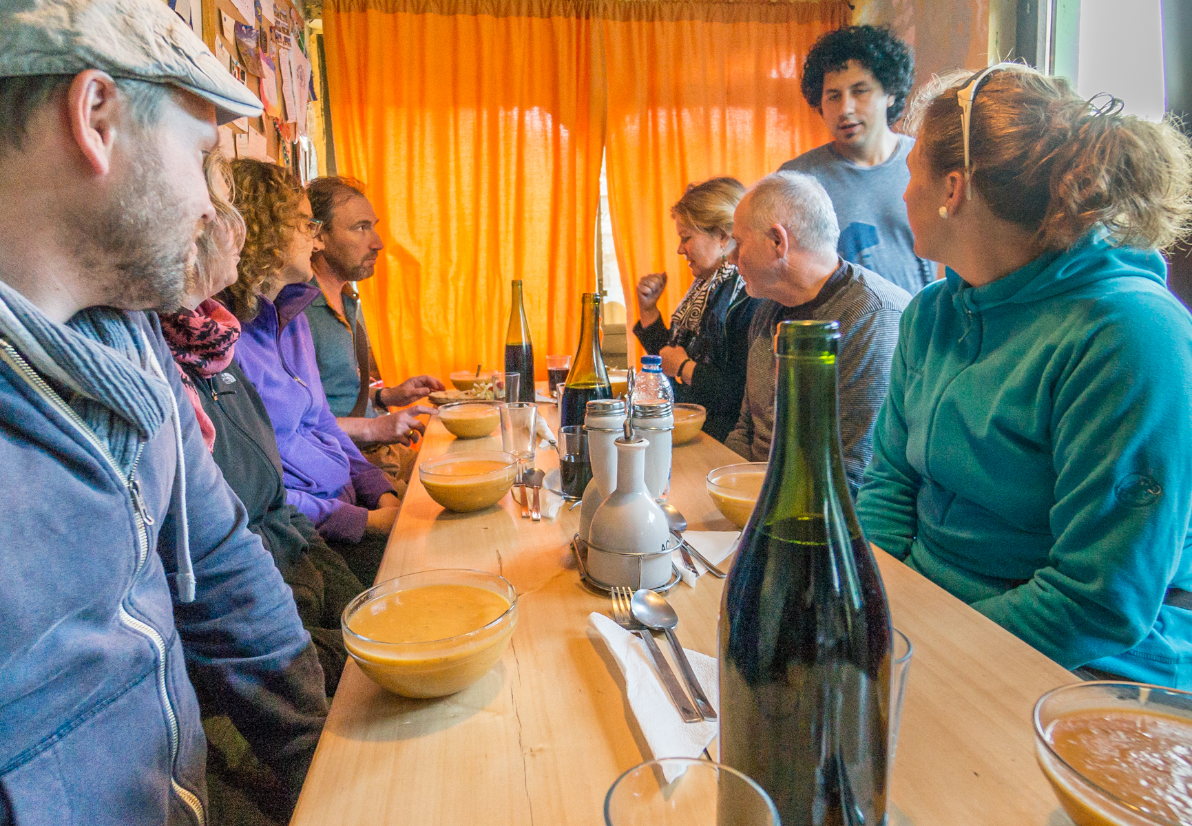 Camino pilgrims about to eat dinner at Albergue Las Herrerías in Herrerías, Spain | Photo by Mike Hudak