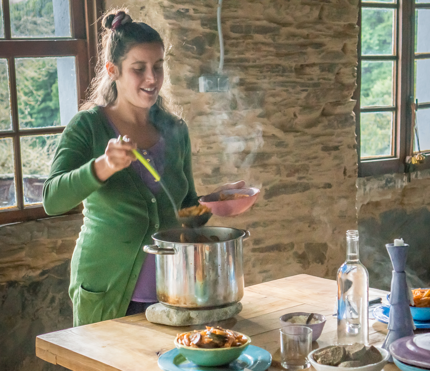 Hospitalera Jessica prepares dinner for Camino pilgrims at Albergue Ecolgico El Beso in A Balsa, Spain | Photo by Mike Hudak