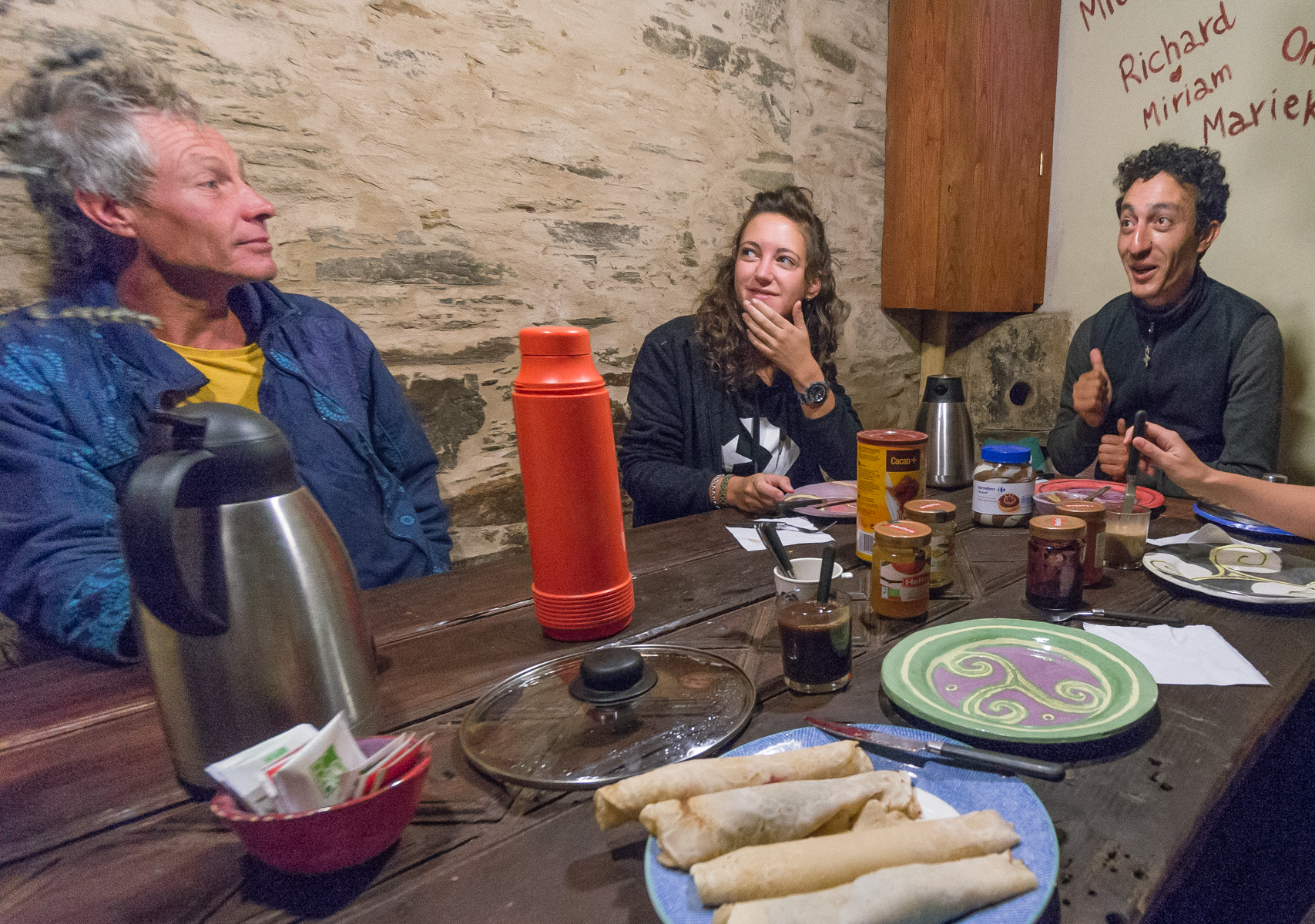 Camino pilgrims enjoy breakfast at Albergue Ecolgico El Beso in A Balsa, Spain | Photo by Mike Hudak