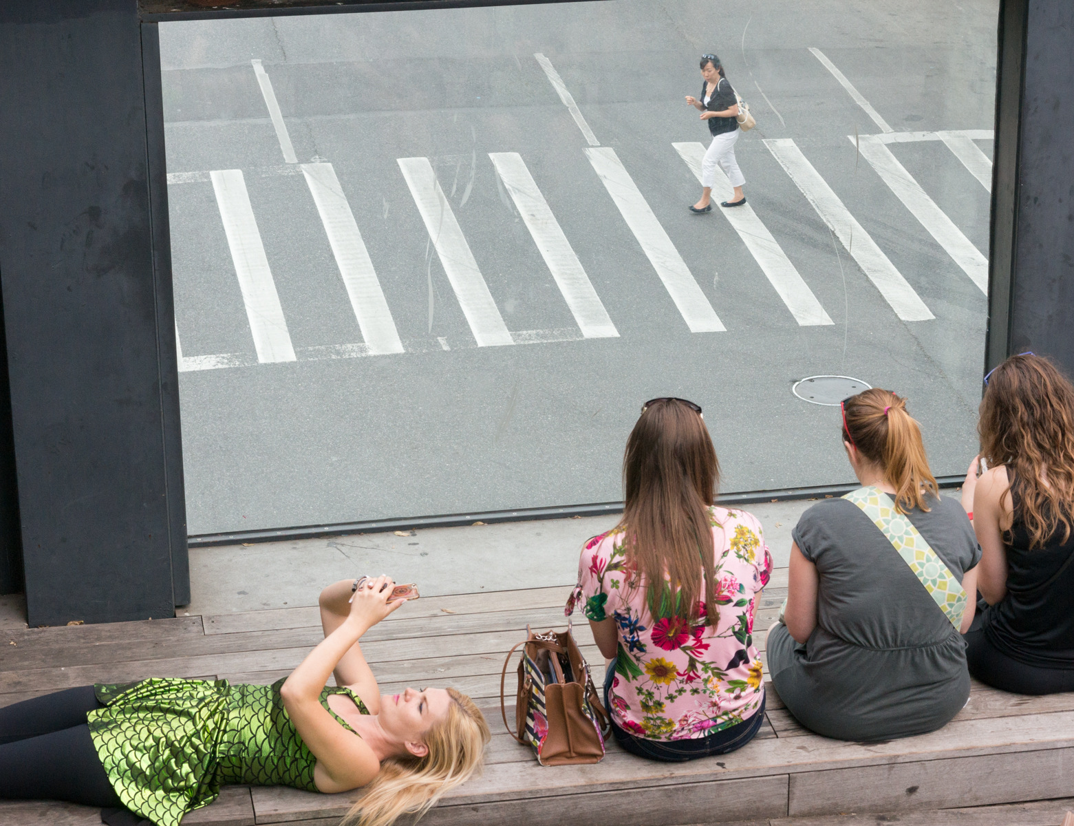 Tenth Avenue Square, an amphitheater in High Line Park, as a pedestrian crosses Tenth Avenue below. Manhattan, NY, USA | Photo by Mike Hudak