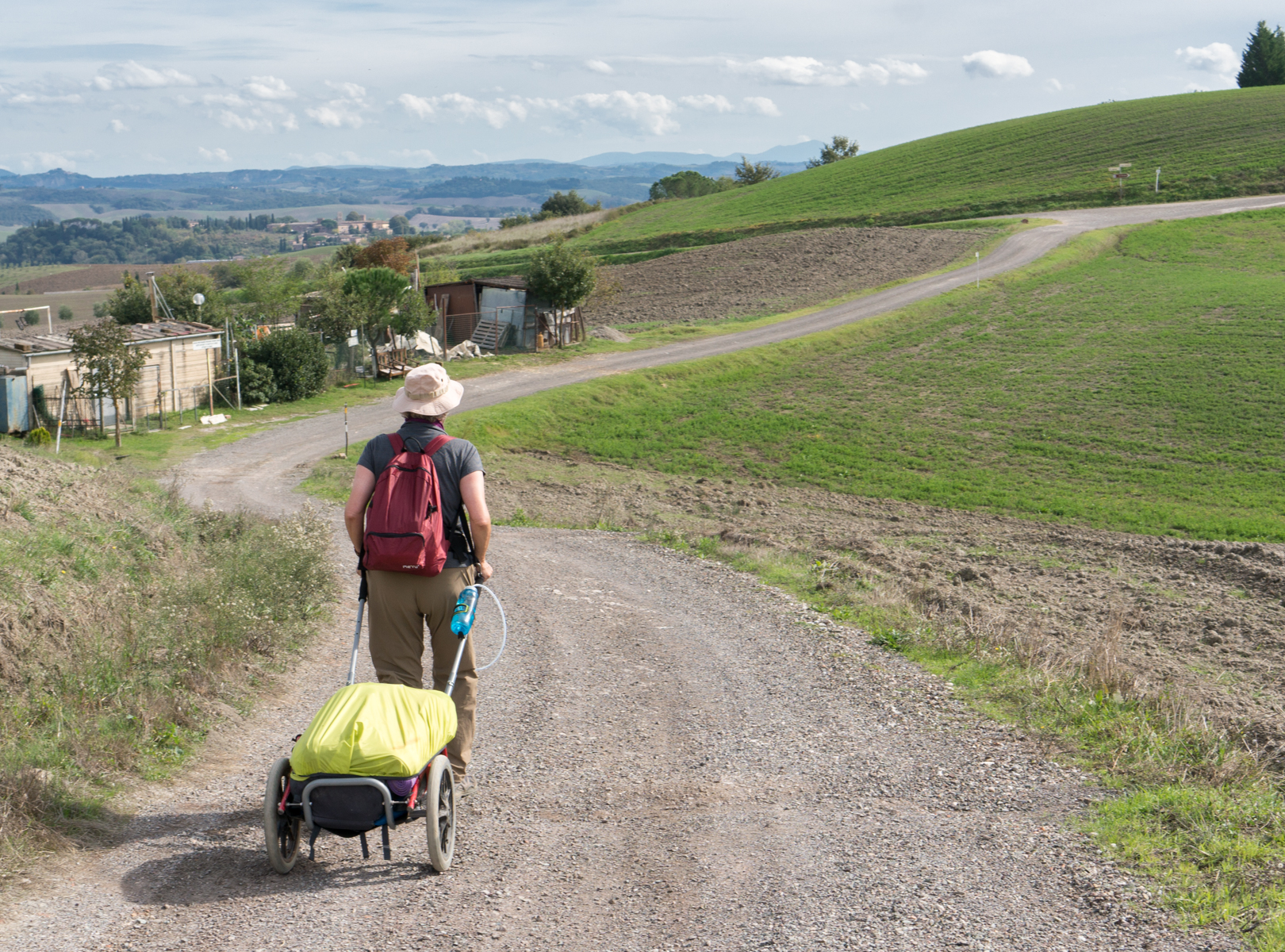 A pilgrim on the Via Francigena in Tuscana south of Isola d'Arbia, Italy | Photo by Mike Hudak